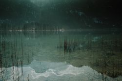Dark shallow water with crystal water in mountains