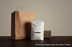 Bag of coffee beans and brown paper bag 49AQW4