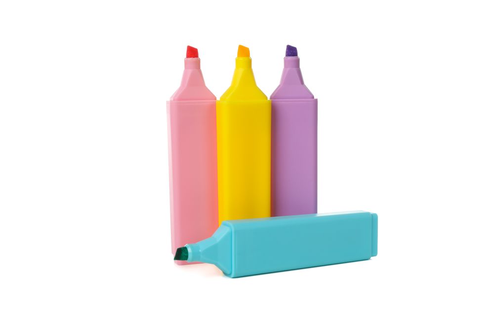 Different color highlighters isolated on blank background