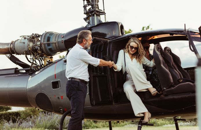 Wealthy woman traveling by her helicopter