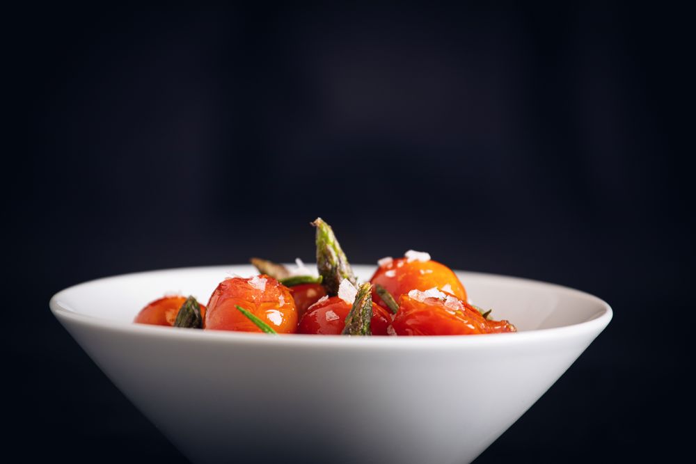 Fresh cherry tomatoes sauteed with green asparagus and rosemary