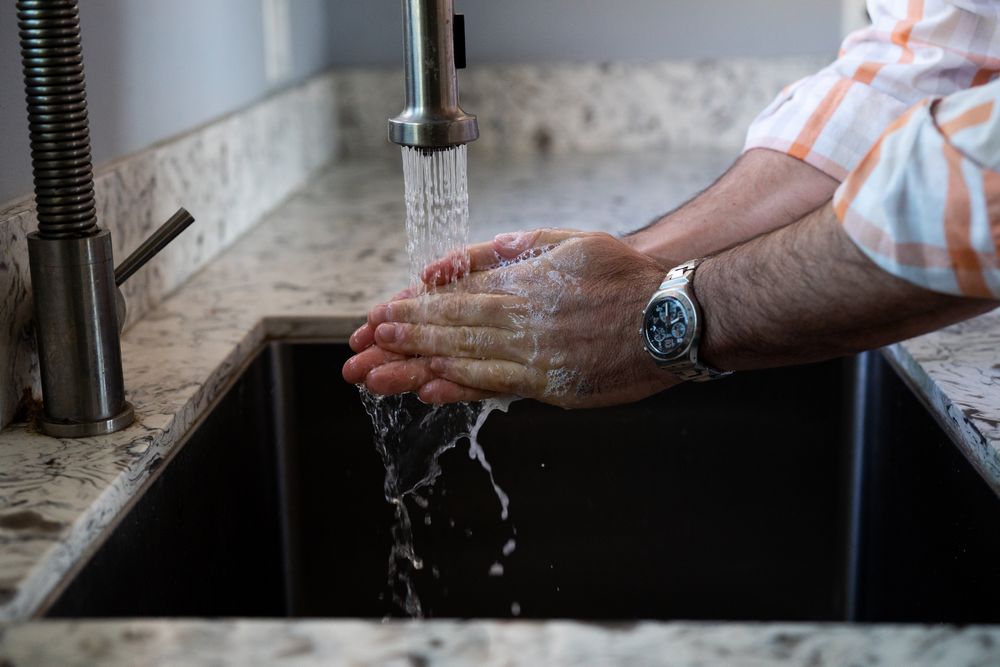 Man washing his hands for hygienic purposes