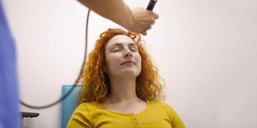 Woman with doctor in eye clinic