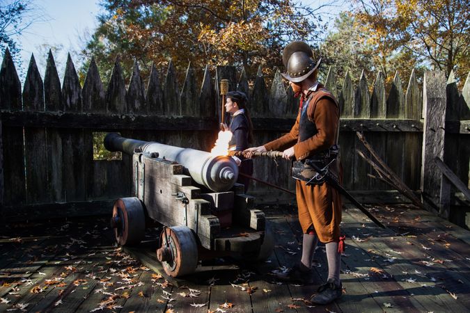 Historic reenactors fire a cannon at the Jamestown Settlement in Jamestown, Virginia