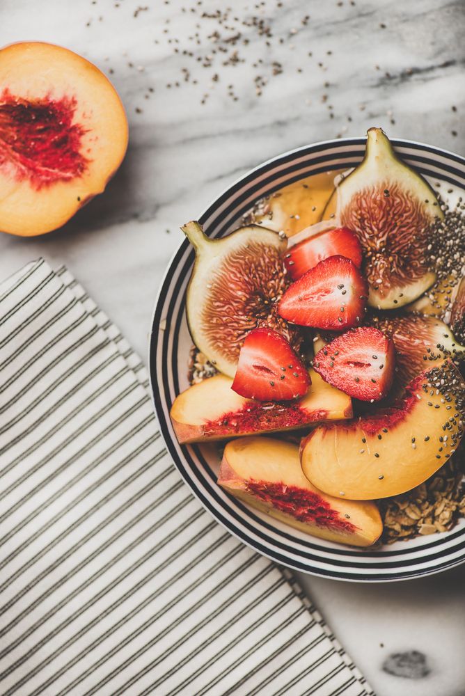 Flat-lay of yogurt bowl with fruit