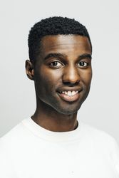 Close up portrait happy Black man in a bright room