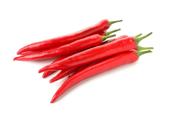Tasty red chilli peppers isolated on blank background