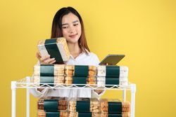 Asian Woman Business Bakery Owner Checking Stock Using Tablet