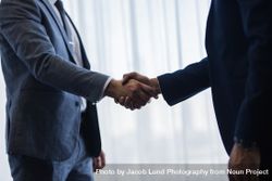 Businessmen handshaking after good deal 0yX6XO