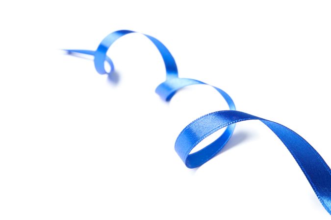 Blue ribbon isolated on plain background. Gift concept