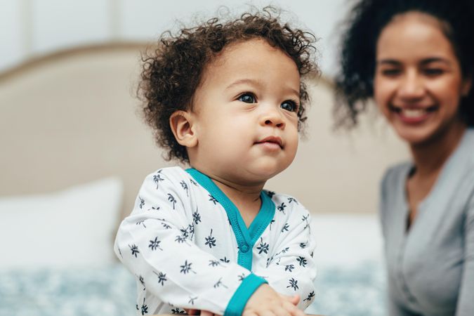 Baby boy with smiling mother