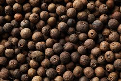 Close up of dark peppercorns