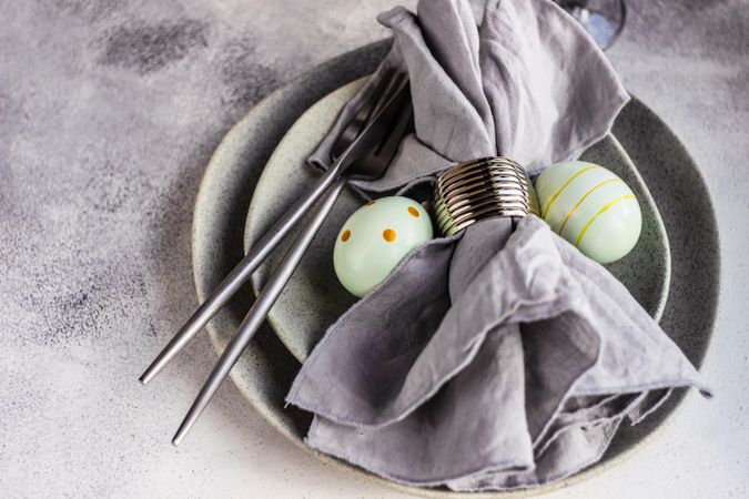 Easter table setting with green decorative eggs