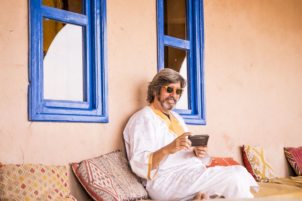 Man sitting on oriental stone terrace