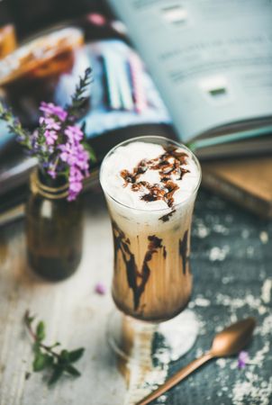 Latte in tall glass with chocolate syrup