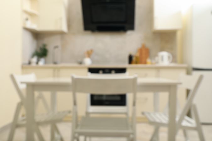 Kitchen interior with wooden table and folding chairs