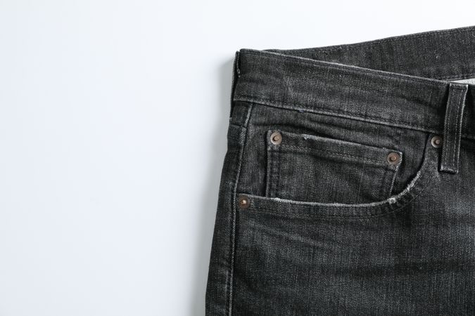 Jeans on light background, space for text