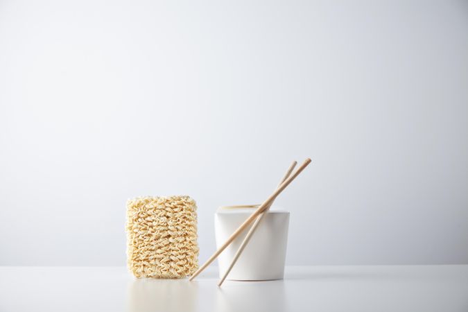 Dry noodles, chopsticks and take away box