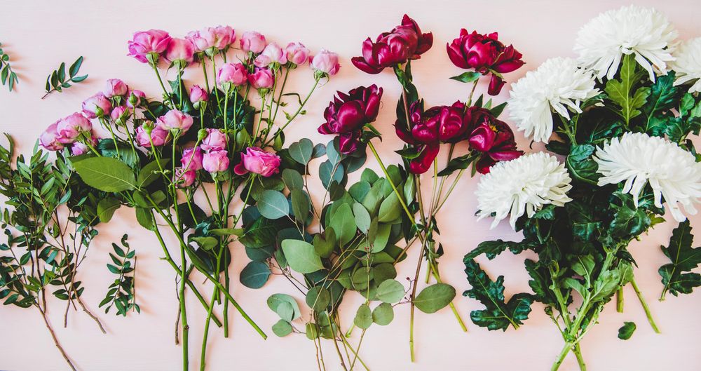 Various summer flowers flat-lay, wide composition