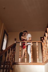 Couple kissing on stairway