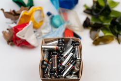 Batteries in a box near sorted trash 563Gx4