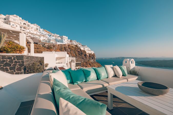 Pillows lined up on outdoor furniture in Santorini