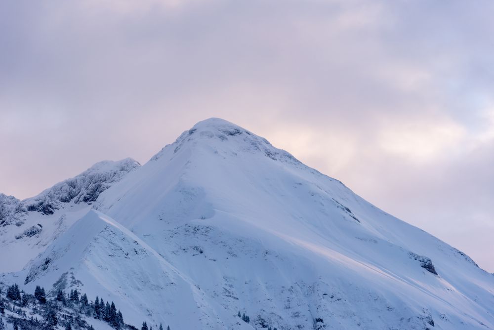 Winter landscape snowy mountain peak in the morning light, in Bavaria, Germany