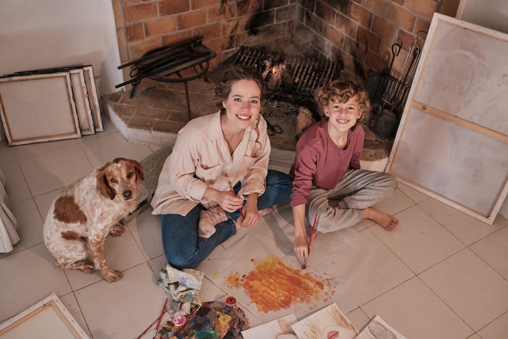 Happy sister and brother painting together