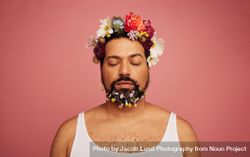 Gay man with flowers on head and beard 5nVvD5