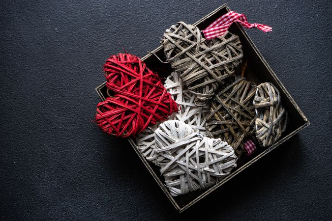Box of thatched heart ornaments 