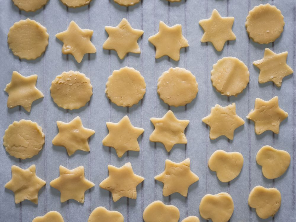 Raw sugar cookies freshly cut to be baked