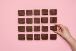 Woman hand grabbing a piece of fudge