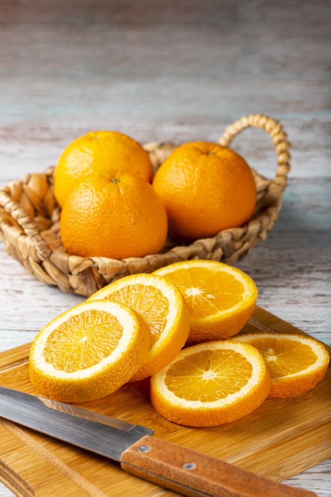 Sliced oranges on the table.