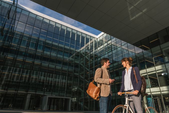 Businesspeople talking on street after work
