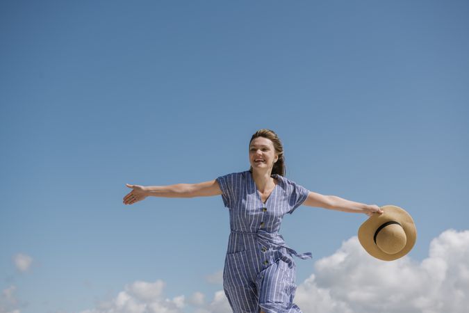 Happy young woman enjoying breeze