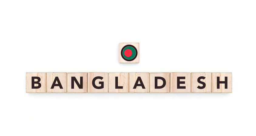 Wooden blocks bearing the name and flag of Bangladesh. Bangladeshi and Asian Culture, national identity, travel, and geography in a copy space design.