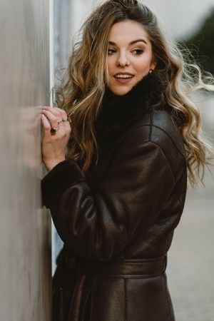 female standing on city street