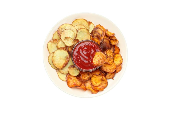 fried sweet potato in a bowl, isolated on light background