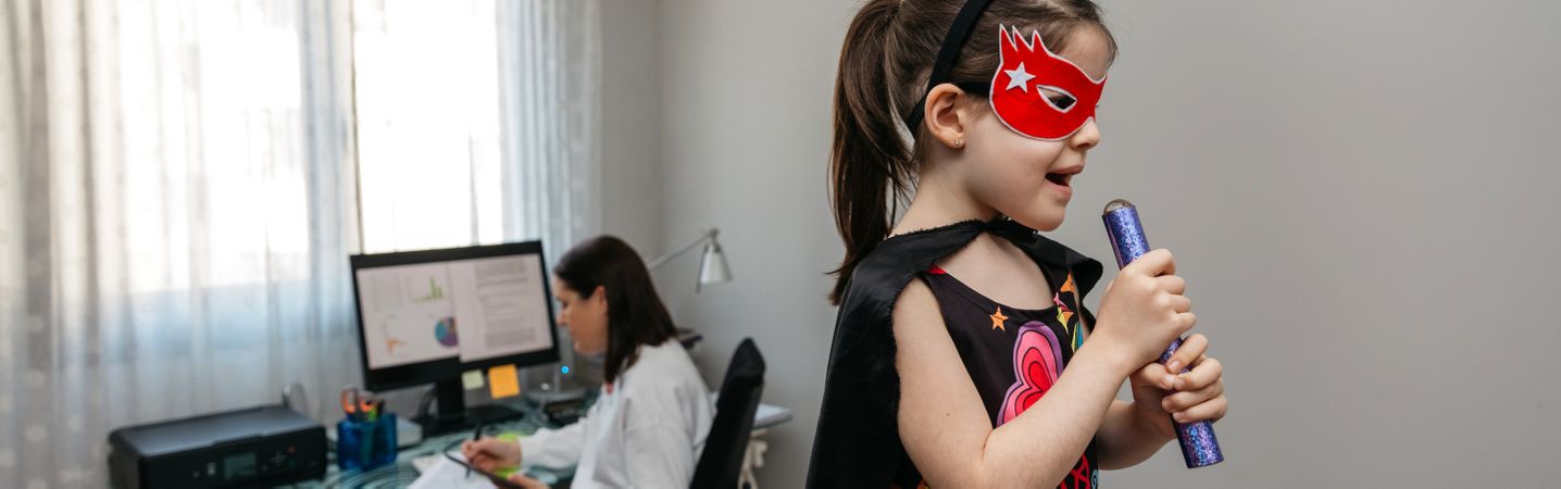Girl singing in disguise while her mother teleworking