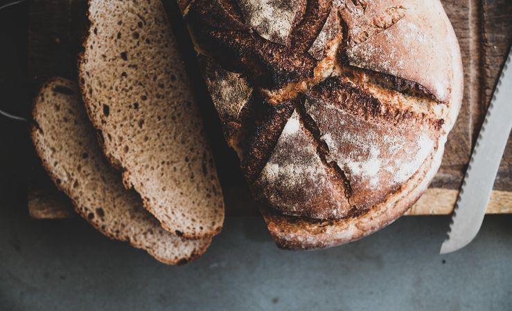 Freshly baked sourdough bread loaf, sliced, close up