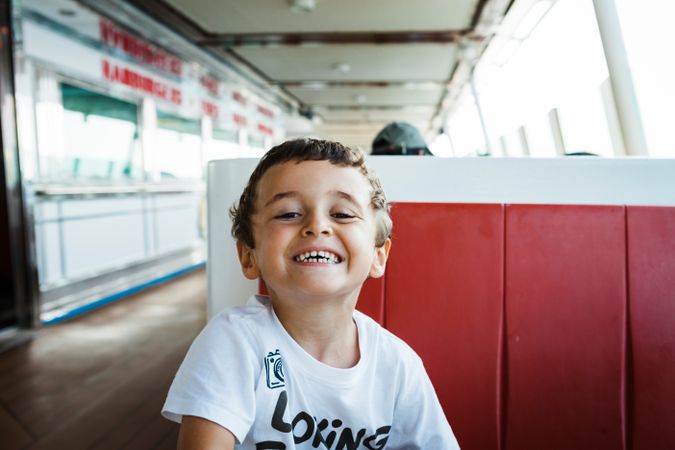 Boy smiling on seat