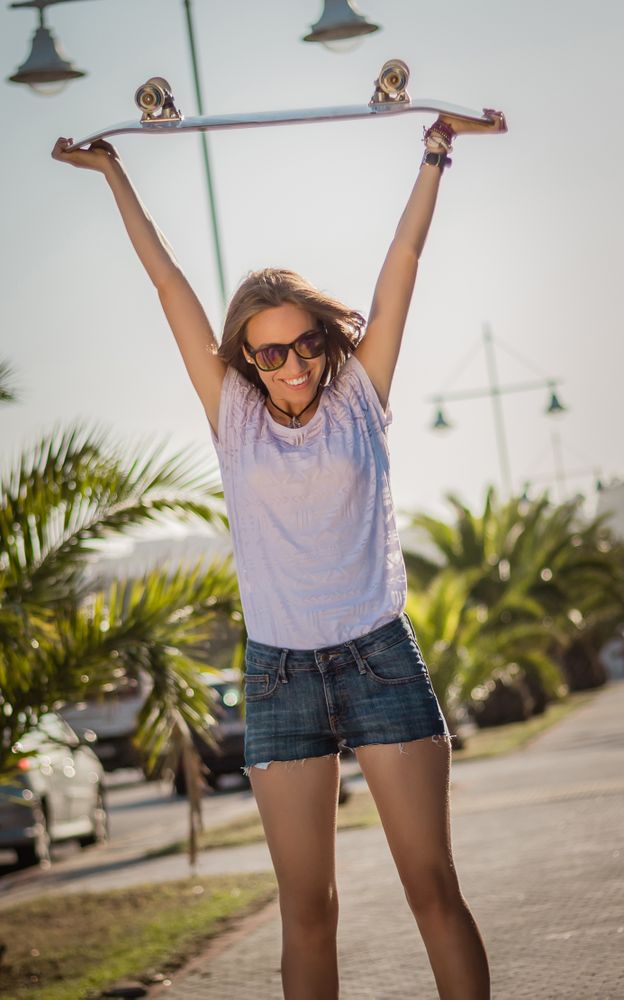 Young girl with a skateboard outdoor