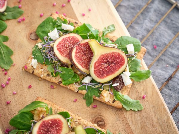 Fresh figs on wooden board