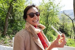 Woman smiling with marijuana pipe