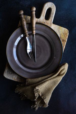 Grey table setting on wooden board