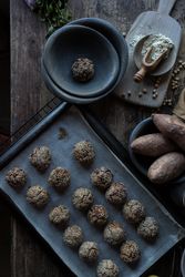 Set of sweet potatoes in sesame seeds on table