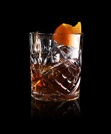 Whisky in glass with orange