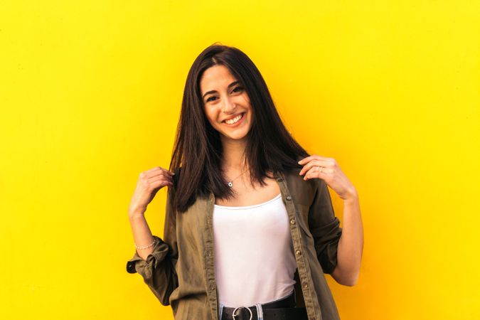 young woman portrait on a yellow background