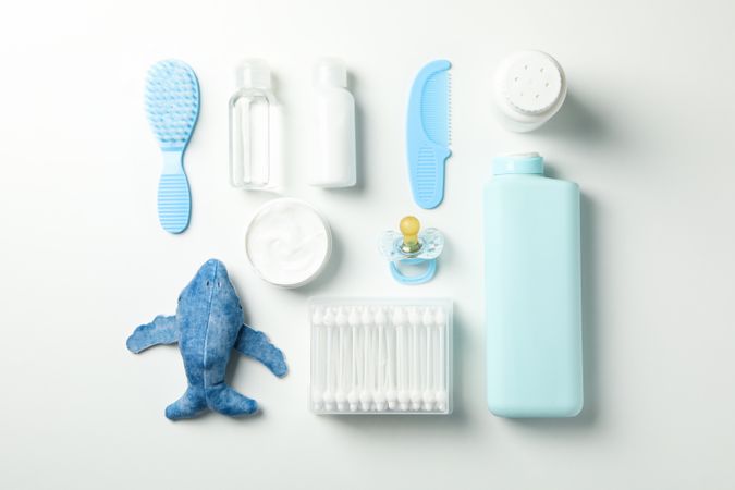 Flat lay with baby hygiene accessories on light background