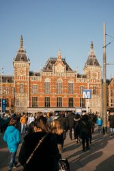 Backs of people approaching Amsterdam station